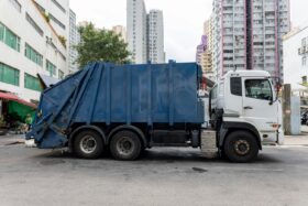 Garbage truck on a street.